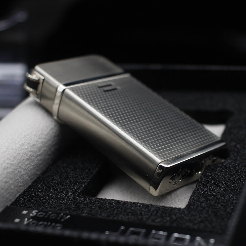 Dual flame refillable metal lighter held in hand, windproof petrol lighter close-up