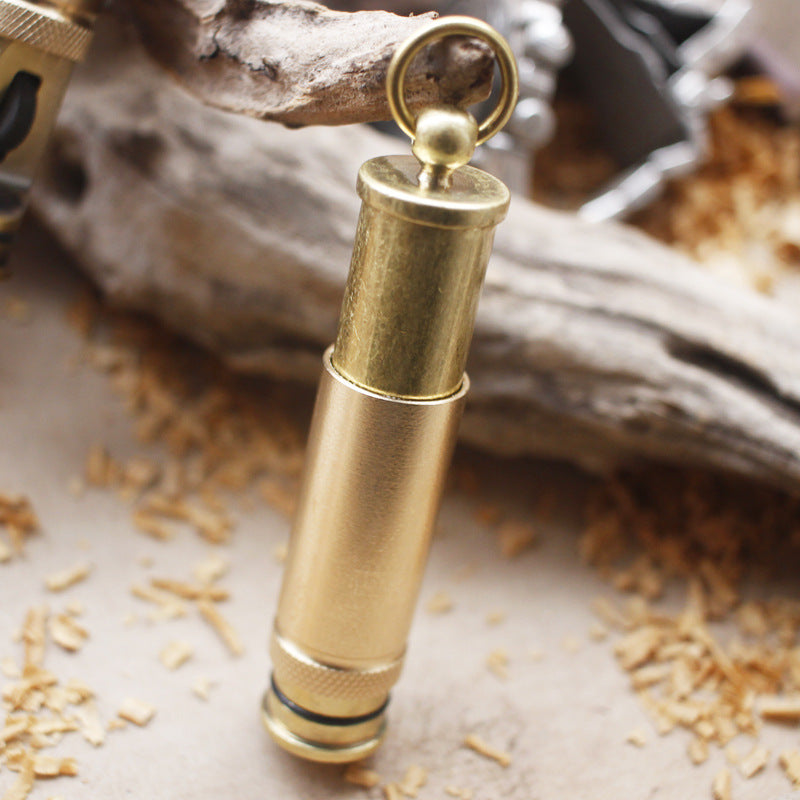 Handheld vintage brass oil lighter with visible wick, refillable petrol lighter close-up
