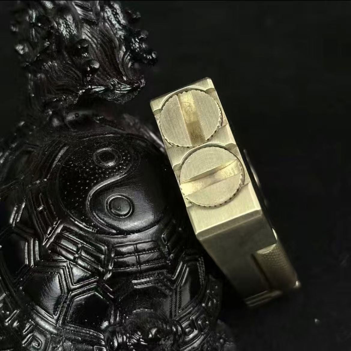 Vintage brass oil lighter with gold finish standing upright, refillable petrol lighter