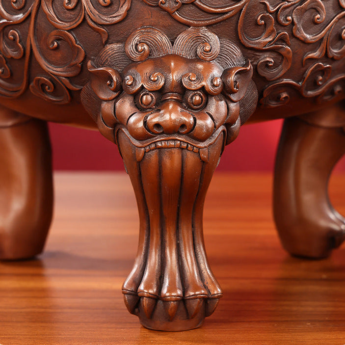 Bronze guardian lion incense burner displayed in a private study setting
