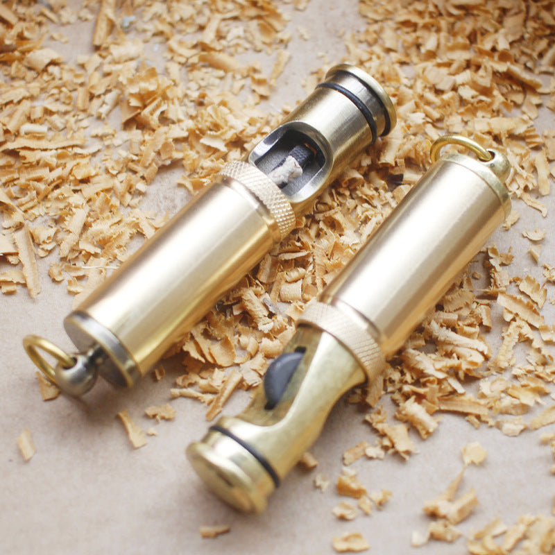 Handheld vintage brass oil lighter with visible wick, refillable petrol lighter close-up
