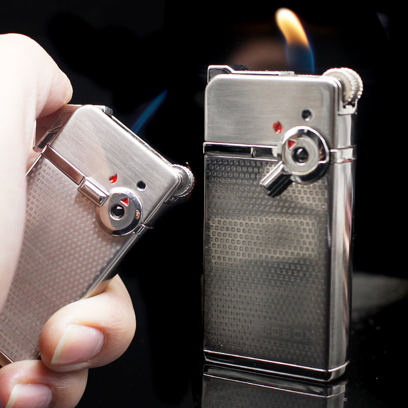 Dual flame refillable metal lighter held in hand, windproof petrol lighter close-up