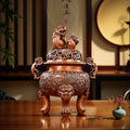 Bronze incense burner with guardian lion motif, designed for a private study.
