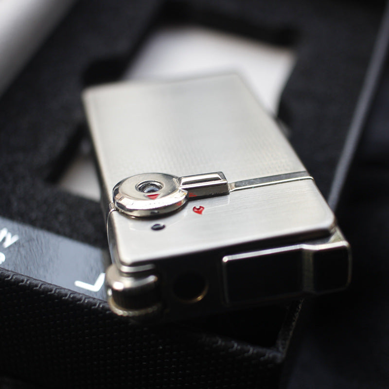 Dual flame refillable metal lighter held in hand, windproof petrol lighter close-up