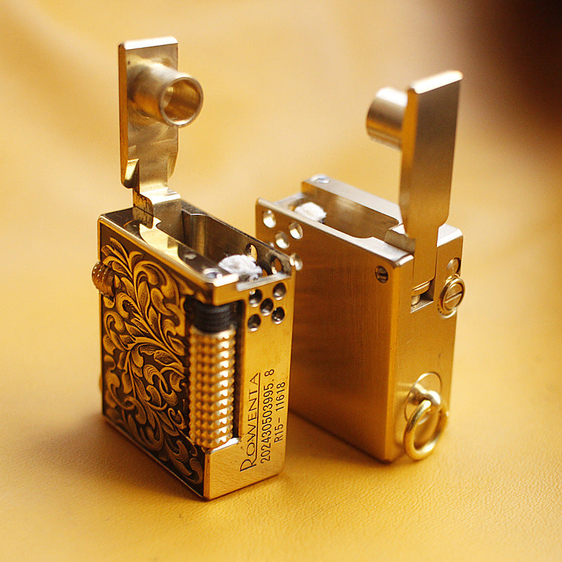 Vintage brass oil lighter keychain hanging, refillable petrol lighter close-up