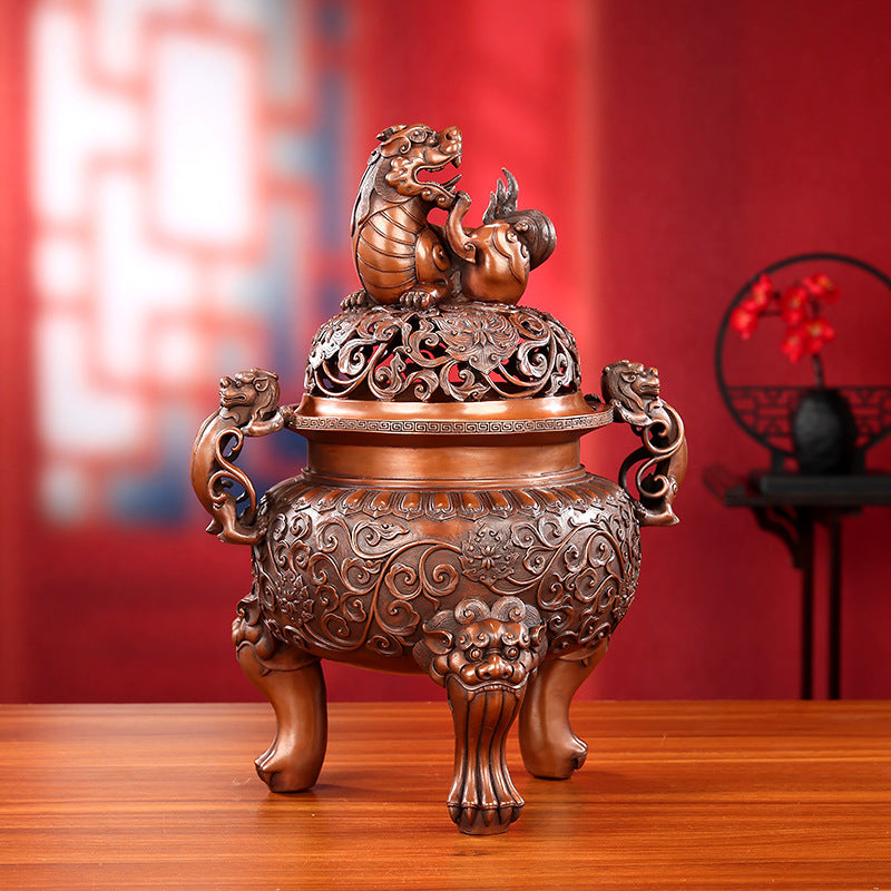 Bronze guardian lion incense burner displayed in a private study setting
