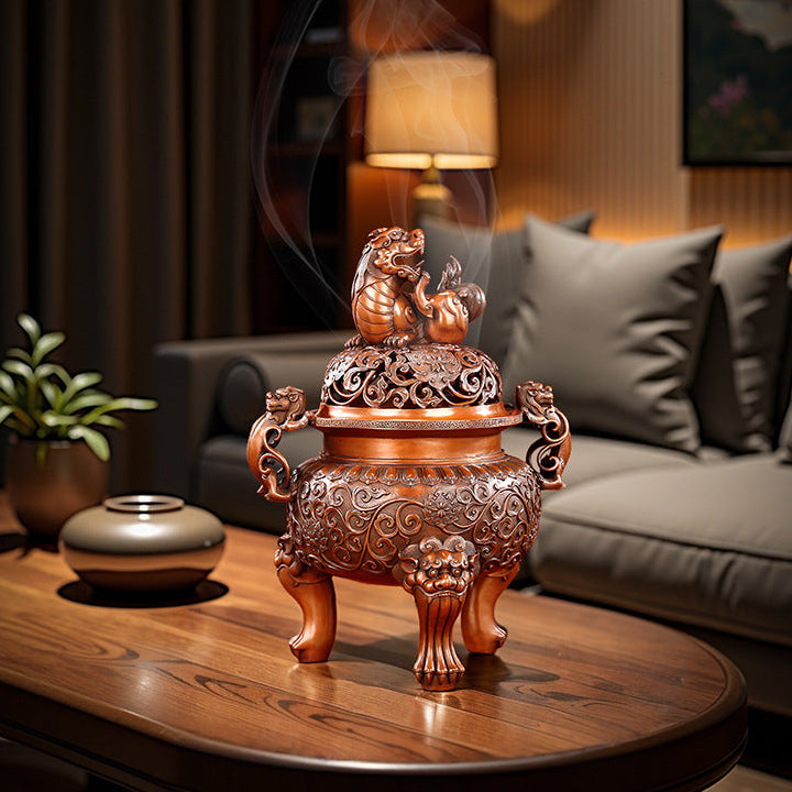 Bronze guardian lion incense burner displayed in a private study setting
