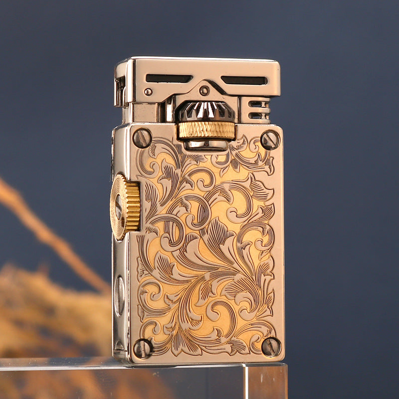 Vintage brass oil lighter with gold finish resting on wooden surface, refillable petrol lighter detail